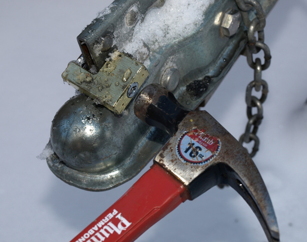 Snowmobile-Trailer-Security-Coupler-lock-being-hammered